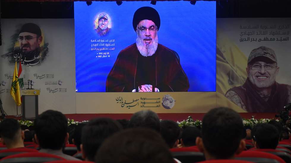 epa09960842 Secretary-General of Hezbollah, Sayyed Hassan Nasrallah, delivers a speech via a screen during a rally marking the sixth anniversary of the assassination of late Hezbollah Resistance military commander Mustafa Badreddine, in a suburb outside Beirut, Lebanon, 20 May 2022. Badreddine who was considered Hezbollah's most senior military commander, was killed in an attack in Syria on 13 May 2016.  EPA/WAEL HAMZEH
