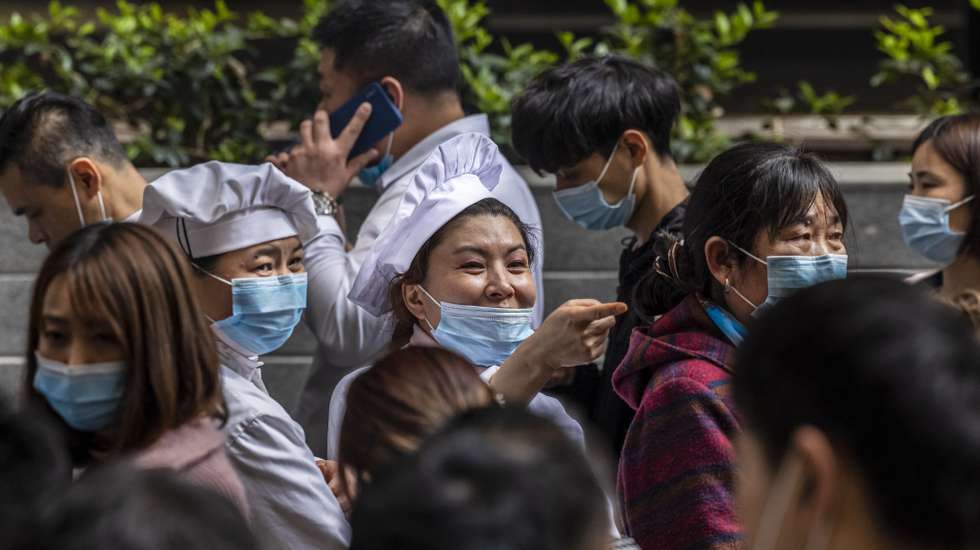 epa09121947 Medical workers direct people in front of the street vaccination booth for Covid-19 in a main shopping area in Shanghai, China, 08 April 2021. On 05 April, Chinese officials reported the biggest daily Covid-19 cases jump in over two months. According to the National Health Commission report of 08 April 2021, the Chinese mainland reported 11 new locally transmitted cases in a southwestern province Yunnan on the border with Myanmar. With street booths for vaccination China tries fulfil its goal of getting 40 percent of the population vaccinated against Covid-19 by June 2021.  EPA/Alex Plavevski