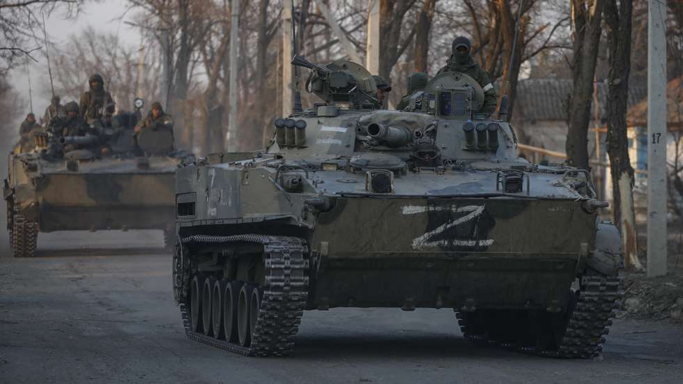 epa09851772 Russian servicemen drive on the infantry armoured vehicles in downtown Volnovakha, Ukraine, 26 March 2022. Troops of the self-proclaimed Donetsk People's Republic with Russian support entered Volnovakha, a small town near Donetsk. Donetsk People's Republic official said that the housing stock of the city of Volnovakha was destroyed by 85 percent, the city would have to be rebuilt. On 24 February Russian troops had entered Ukrainian territory in what the Russian president declared a 'special military operation', resulting in fighting and destruction in the country, a huge flow of refugees, and multiple sanctions against Russia.  EPA/SERGEI ILNITSKY