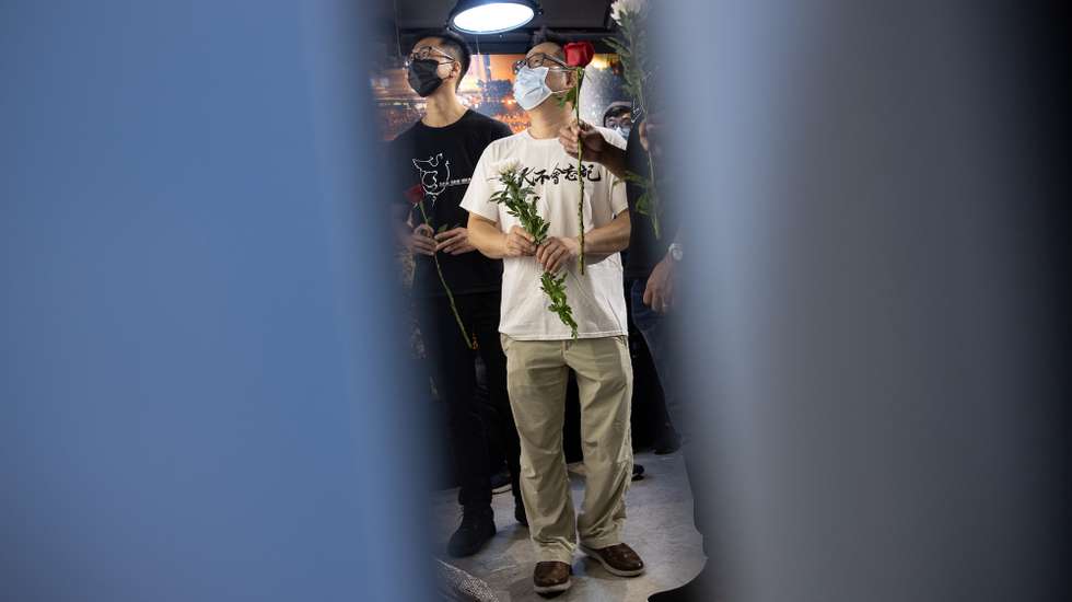epa09236392 Members of the Hong Kong Alliance in Support of Patriotic Democratic Movements of China Lo Wai-ming (R), and Leung Kam-wai (L), pay tribute to the victims of the 1989 Tiananmen Massacre at the June 4th Museum in Hong Kong, China, 30 May 2021. Police have banned the annual June 4 candlelight vigil at Victoria Park, citing risks of COVID-19 infection for the second year in a row. The vigil marks the 1989 Tiananmen Square massacre that took place in Beijing.  EPA/JEROME FAVRE