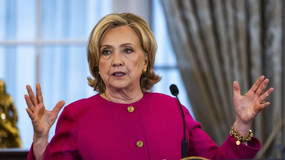 epa10884765 Former Secretary of State Hillary Clinton speaks ahead of the unveiling of her official portrait at the State Department in Washington, DC, 26 September 2023. Former President Bill Clinton also attended the ceremony.  EPA/JIM LO SCALZO