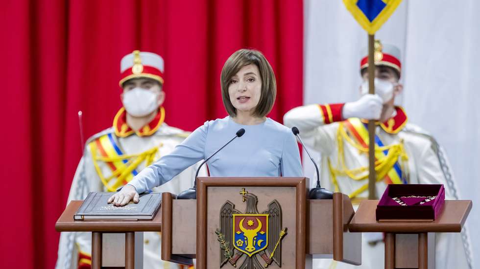 epa08902315 Moldova's new President Maia Sandu is sworn in on the Moldova's Constitution during her inauguration ceremony at the Republican Palace in Chisinau, Moldova, 24 December 2020. The former prime minister and leader of Action and Solidarity Party defeated incumbent President Igor Dodon in the second round of elections held on 15 November 2020.  EPA/DUMITRU DORU