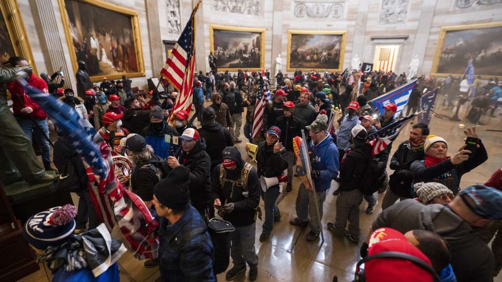 epa08923423 Supporters of US President Donald J. Trump in the Capitol Rotunda after breaching Capitol security in Washington, DC, USA, 06 January 2021. Protesters entered the US Capitol where the Electoral College vote certification for President-elect Joe Biden took place.  EPA/JIM LO SCALZO