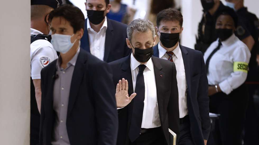 epa09272900 Former French President Nicolas Sarkozy (C) arrives at the Paris courthouse for the trial over alleged illegal financing of his failed 2012 re-election campaign, at the courthouse in Paris, France, 15 June 2021. The trial is resuming after being adjourned on its opening day on 17 March 2021 when a lawyer fell ill with Covid-19.  EPA/YOAN VALAT