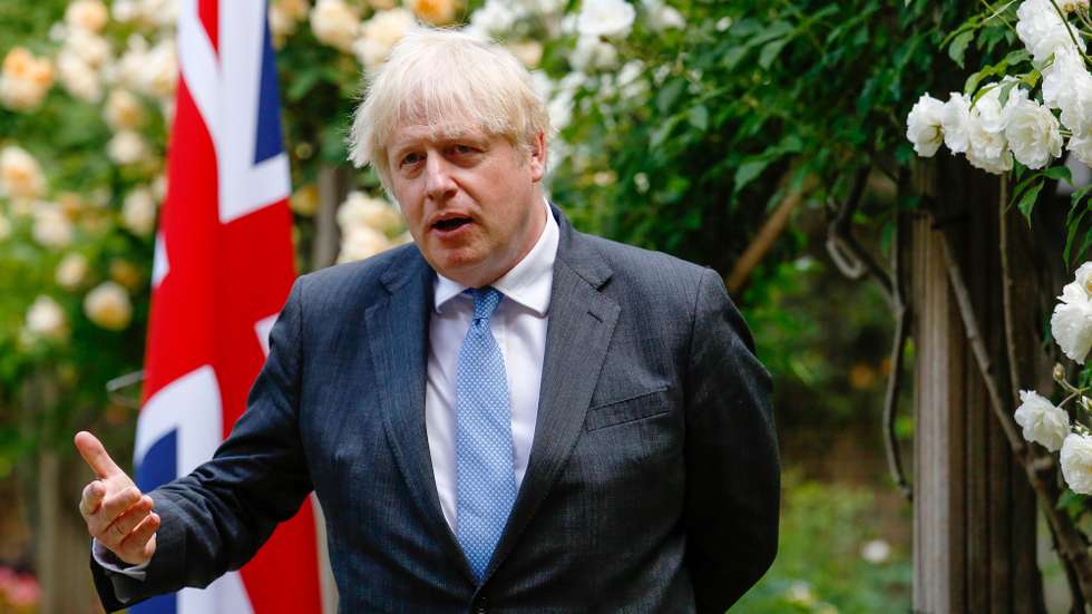 epa09272673 British Prime Minister Boris Johnson, gestures during a joint news conference with Australian counterpart Scott Morrison, during their bilateral meeting in the garden of number 10 Downing Street in London, Britain, 15 June 2021. The U.K. is set to announce the broad terms of a free-trade deal with Australia on 15 June, its latest post-Brexit accord as Prime Minister Boris Johnson seeks to expand commerce beyond the European Union.  EPA/Luke MacGregor / POOL