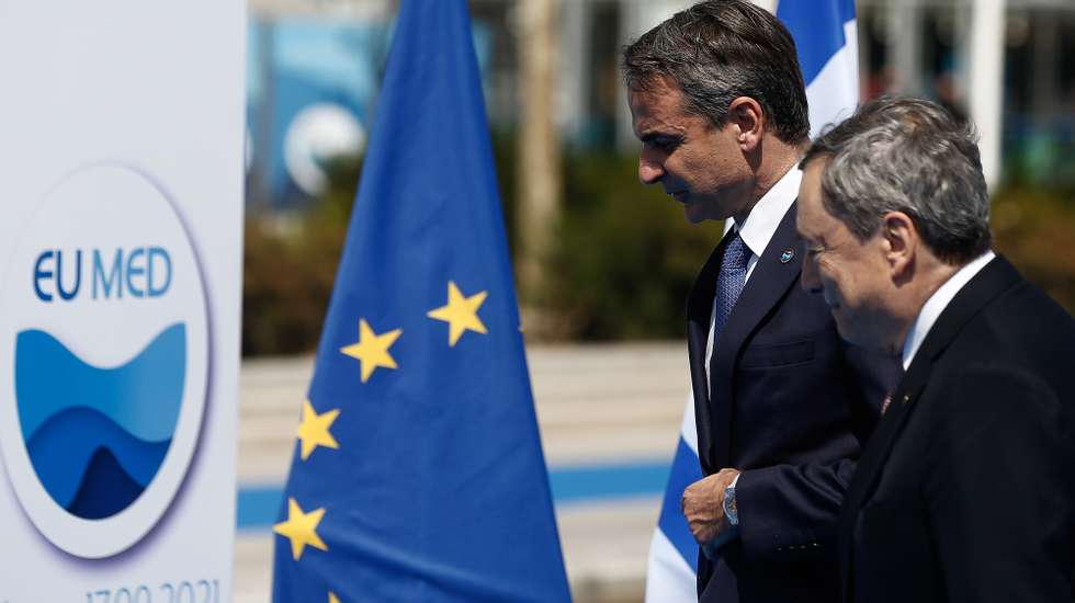 epa09473128 Greek Prime Minister Kyriakos Mitsotakis (L) welcomes Italian Prime Minister Mario Draghi (R), at the EUMed9 Summit, in Athens, Greece, 17 September 2021.The agenda of the Summit, which acquires special geopolitical weight, includes security challenges in the Mediterranean that endanger stability in the region, potential new crises, such as the threat of migration flows after the latest developments in Afghanistan. The leaders participating will include Mitsotakis, French President Emmanuel Macron, Spanish Prime Minister Pedro Sanchez, Italian Prime Minister Mario Draghi, Croatian Prime Minister Andrej Plenkovic, Cyprus President Nicos Anastasiades, Malta Prime Minister Robert Abela, Slovenian Prime Minister Janez Jansa and Portuguese Foreign Minister Augusto Santos Silva.  EPA/YANNIS KOLESIDIS