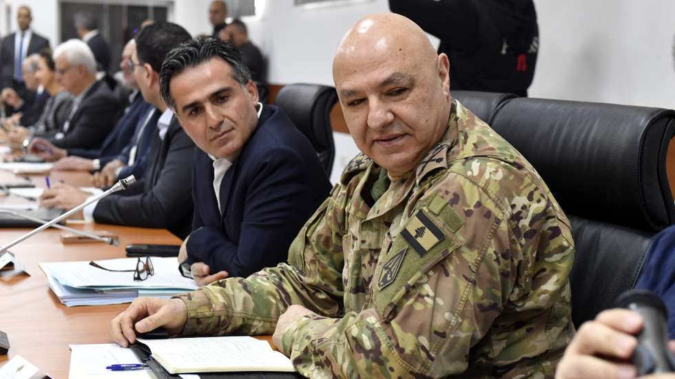 epa11761855 Commander of the Lebanese Armed Forces, General Joseph Aoun (R) attends a cabinet meeting at Benoit Barakat barracks in Tyre, southern Lebanon, 07 December 2024. The Lebanese government held a cabinet meeting in Tyre to discuss a number of issues related to the operational plan to increase the deployment of the army, a draft law for the restoration of demolished buildings and a mechanism for surveying agricultural damage, in addition to measures related to the removal of rubble, according to Lebanon's National News Agency (NNA).  EPA/WAEL HAMZEH