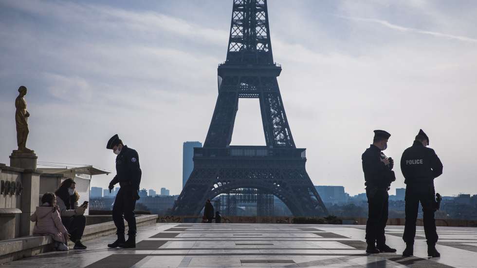 epa08804617 French Police officers patrol and control the mobility paper in the deserted Trocadero square near the Eiffel Tower during the second national lockdown, dubbed reconfinement, in Paris, France, 07 November 2020. France is into a second lockdown for a minimum of four weeks to battle the rise in Covid-19 cases, effectively shutting down bars, cafes and restaurants and requiring non-essential workers to remain home.  EPA/CHRISTOPHE PETIT TESSON