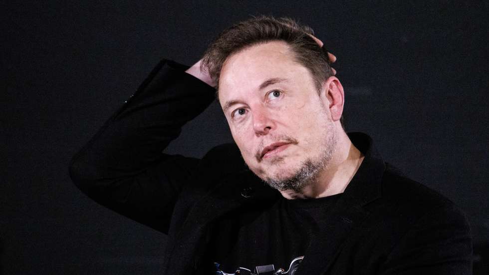 epaselect epa10955397 US tech entrepreneur Elon Musk, owner of Tesla, SpaceX and X, gestures as he attends a conversation event with British Prime Minister Rishi Sunak (unseen) in central London, Britain, 02 November 2023. The conversation will be streamed on X (formerly Twitter) and follows the two-day AI Safety Summit that was held at Bletchley Park.  EPA/TOLGA AKMEN / POOL