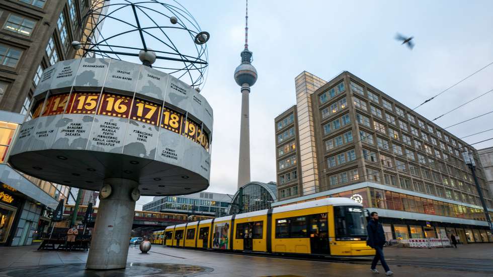 epaselect epa08886866 A tram passes the Alexanderplatz during the morning rush hour in Berlin, Germany, 16 December 2020. As the number of cases of the COVID-19 disease caused by the SARS-CoV-2 coronavirus is still rising throughout Germany, the government has imposed a second hard lockdown with businesses closing from 16 December on until 10 January 2021.  EPA/ALEXANDER BECHER