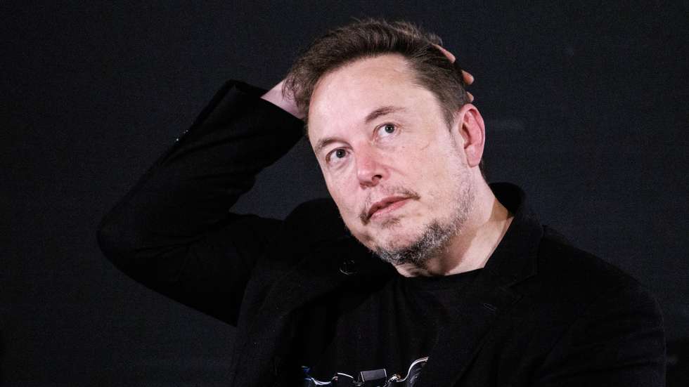 epaselect epa10955397 US tech entrepreneur Elon Musk, owner of Tesla, SpaceX and X, gestures as he attends a conversation event with British Prime Minister Rishi Sunak (unseen) in central London, Britain, 02 November 2023. The conversation will be streamed on X (formerly Twitter) and follows the two-day AI Safety Summit that was held at Bletchley Park.  EPA/TOLGA AKMEN / POOL