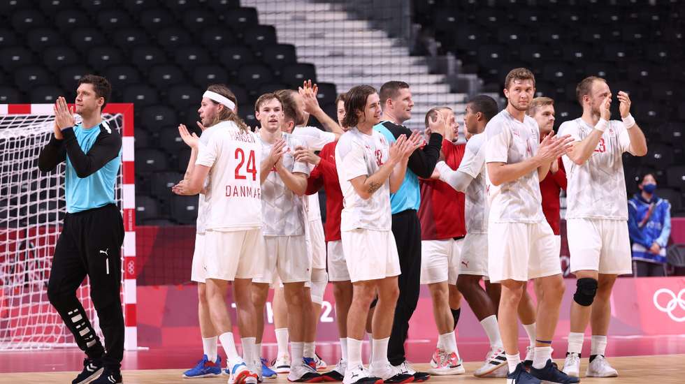 epa09379818 Players of Denmark celebrate after the Men's Handball preliminary round match between Portugal and Denmark at the Tokyo 2020 Olympic Games at the Yoyogi National Gymnasium arena in Tokyo, Japan, 30 July 2021.  EPA/WU HONG