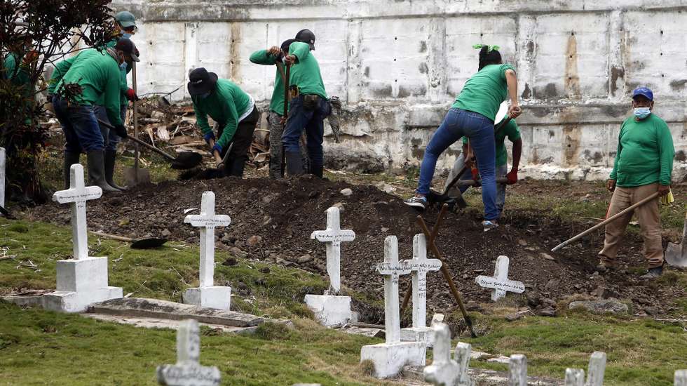 epa09081883 A group of workers help to excavate during a day of exhumation in the cemetery of the municipality of Dabeiba, Colombia, 11 March 2021 (issued 18 March 2021). Jaime de Jesus Arango removes more than dirt in the Las Mercedes cemetery. When he picks up small amounts of material, he shakes up one of the darkest chapters of the Colombian armed conflict, while trying to find part of the truth about the "false positives". His work as a gravedigger in this cemetery in the municipality of Dabeiba, in the department of Antioquia (northwest), varies during the proceedings carried out by the Special Jurisdiction for Peace (JEP), which in December 2019 began several excavations there after receiving statements from members of the Army who acknowledged having participated in extrajudicial executions and revealed the place of the graves.  EPA/Luis Eduardo Noriega A. ACOMPAÃ‘A CRÃ“NICA: COLOMBIA CONFLICTO