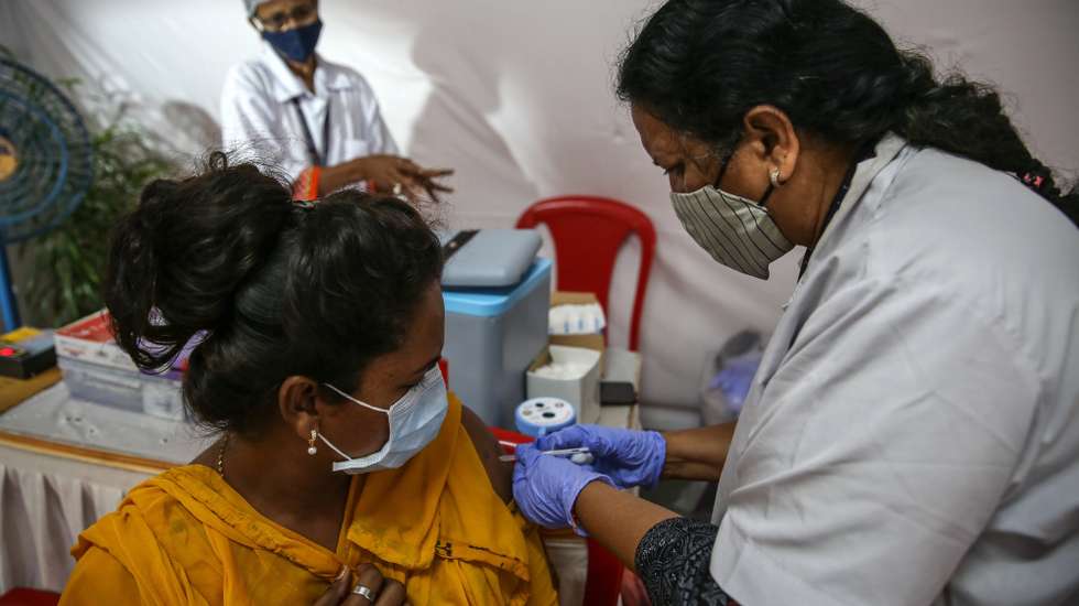 epa09432161 A transgender person gets a dose of a Covid-19 vaccine at a dedicated vaccination centre for the LGBT community, in Mumbai, India, 27 August 2021. The Brihanmumbai Municipal Corporation (BMC) along with social welfare organization Kinnar Maa Ek Samajik Sanstha, opened the cityâ€™s first dedicated COVID19 vaccination centre for the Transgender person, Hijras and LGBT community, who were facing difficulty in getting vaccine.  EPA/DIVYAKANT SOLANKI
