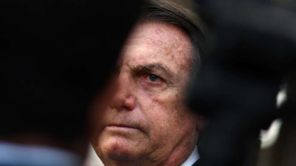 epa10742610 Former Brazilian President Jair Bolsonaro makes a statement after leaving the headquarter of the Federal Police in Brasilia, Brazil, 12 July 2023. Bolsonaro presented his testimony in a case of alleged coup denounced by Brazilian right-wing senator Marcos do Val.  EPA/Andre Borges
