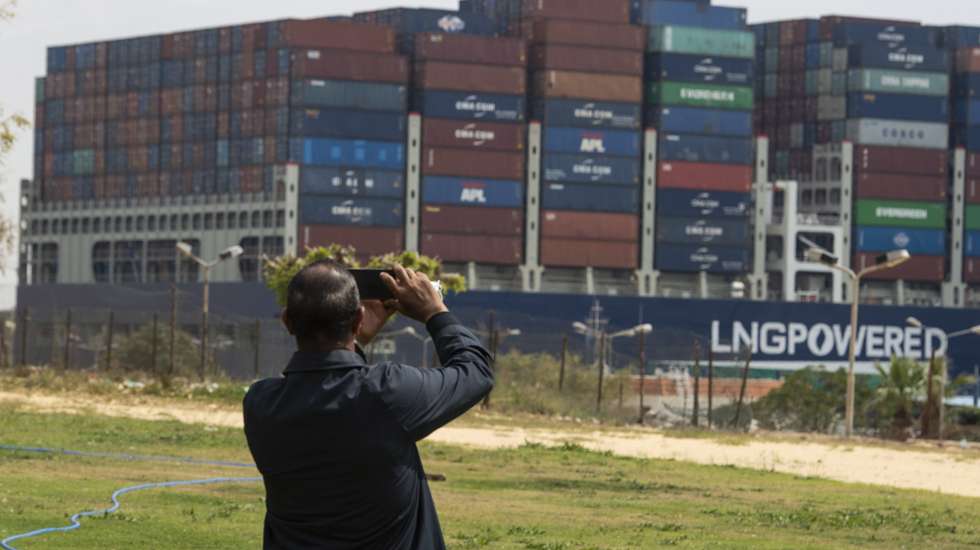 epa09106426 A container ship starts moving in the Suez Canal, in Ismalia, Egypt, 30 March 2021. The Suez Canal Authority on 29 March said that traffic is to resume after the large container ship 'Ever Given' was refloated and 43 vessels had resumed transit so far from the Great Bitter Lake, which separates two sections of the canal. The Ever Given ran aground in the Suez Canal on 23 March, causing a huge traffic backlog of ships.  EPA/Mohamed Hossam