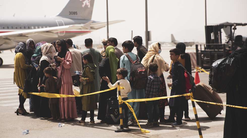 epa09421074 A handout photo made available by US Central Command Public Affairs shows civilians preparing to board a plane during an evacuation at Hamid Karzai International Airport, Kabul, Afghanistan, 18 August 2021 (issued 19 August 2021). US Marines are assisting the Department of State with an orderly drawdown of designated personnel in Afghanistan. (U.S. Marine Corps photo by Staff Sgt. Victor Mancilla) EPA/Staff Sgt. Victor Mancilla/ US Central Command Public Affairs HO Released By:LT Robert MookPublic Affairs OfficerJoint Task Force-Crisis Responserobert.e.mook2.mil@mail.mil HANDOUT EDITORIAL USE ONLY/NO SALES