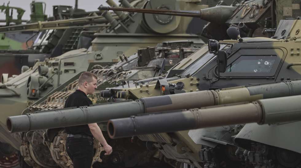 epa11306409 A man examines armoured vehicles captured by Russian troops during a special military operation in Ukraine during an exhibition on the Poklonnaya Hill in Moscow, 28 April 2024. The exhibition of captured weapons will open on May 01 and will last a month. Visitors will see more than 30 samples of equipment made in the USA, Great Britain, Germany, France, Turkey, Sweden, Czechoslovakia, South Africa, Finland, Australia, Austria and Ukraine.  EPA/SERGEI ILNITSKY