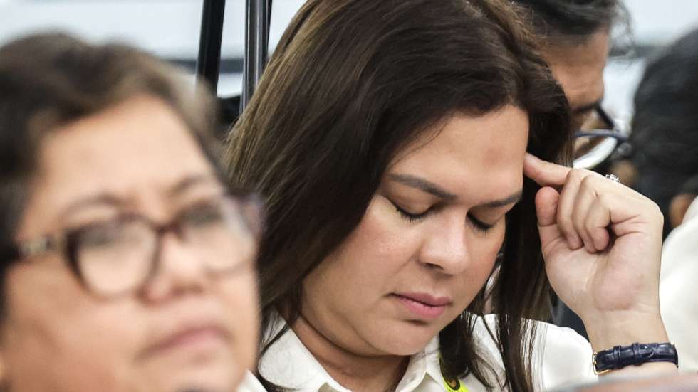 epa11718394 Philippine Vice-President Sara Duterte (R) reacts as she sits in the audience during a joint committee hearing of the House of Representatives (HOR) of her father, former Philippine president Rodrigo Duterte (not pictured), in Quezon City, Metro Manila, Philippines, 13 November 2024. The HOR continues its investigation into Duterte's war on drugs campaign, which resulted in thousands of reported cases of extrajudicial killings and human rights violations.  EPA/ROLEX DELA PENA