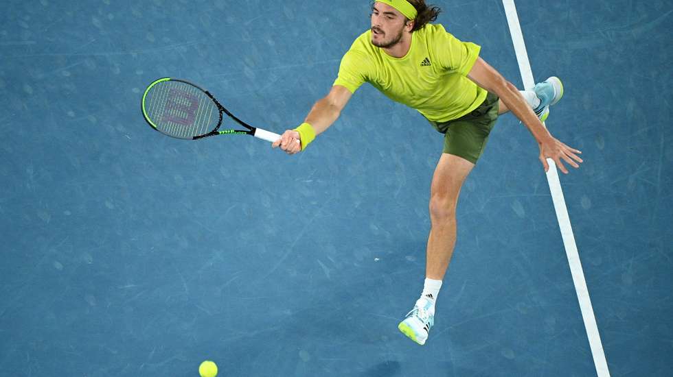 epa09017842 Stefanos Tsitsipas of Greece in action during his Men's singles quarter finals match against Rafael Nadal of Spain on Day 10 of the Australian Open Grand Slam tennis tournament at Melbourne Park in Melbourne, Australia, 17 February 2021.  EPA/DEAN LEWINS AUSTRALIA AND NEW ZEALAND OUT