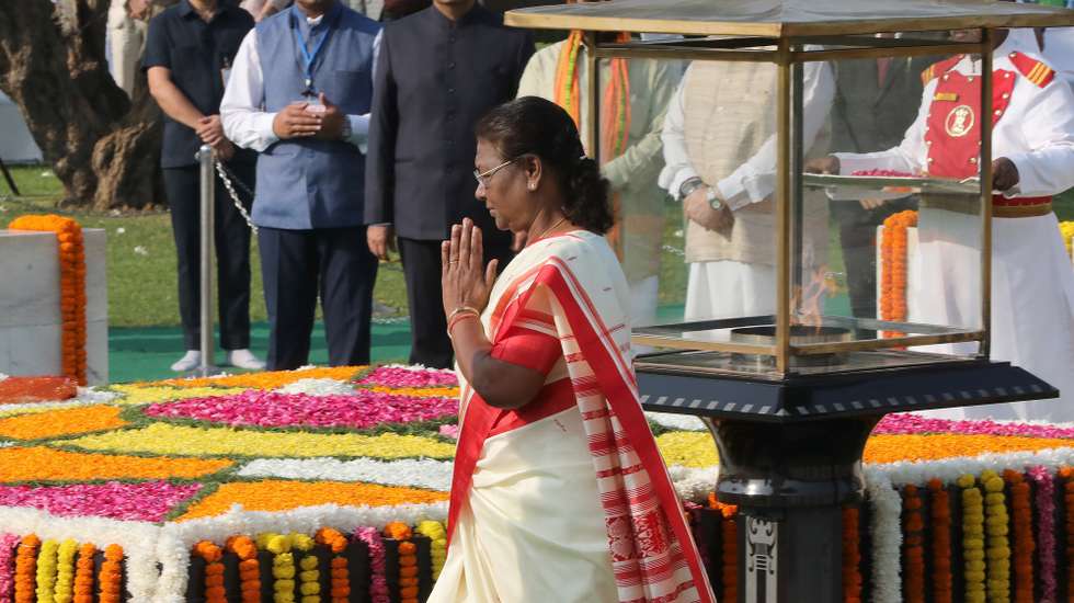 epa10894992 Indian President Droupadi Murmu pays tribute at Mahatma Gandhi's Raj Ghat memorial on the occasion of Gandhi Jayanti, in New Delhi, India, 02 October 2023. Gandhi Jayanti is celebrated annually across India on 02 October, to mark the birthday of Mahatma Gandhi. This year marks the 154th birth anniversary of Mahatma Gandhi, also known as the father of the Indian nation.  EPA/HARISH TYAGI