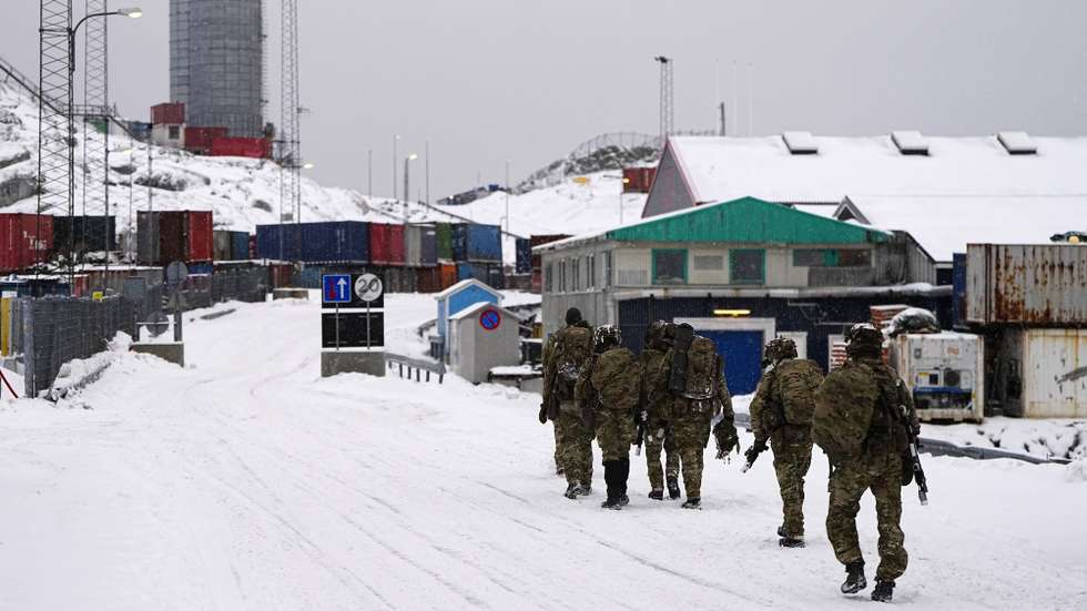 epa12659168 Danish soldiers walk on a street after disembarking at the port in Nuuk, Greenland, 18 January 026. The Danish Defense will continue the increased presence with exercise activities together with a number of NATO allies in and around Greenland in 2026. This is done in cooperation with the Greenlandic authorities and the Greenlandic government, Naalakkersuisut, as stated on the Danish Defense website.  EPA/Mads Claus Rasmussen  DENMARK OUT