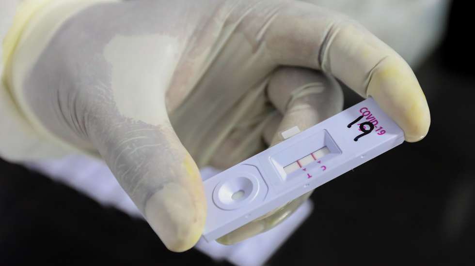 epa08869840 A Sri Lankan health officer performs a COVID-19 Rapid Antigen Test at a mobile laboratory just after collecting a swab from a lockdown area in Colombo, Sri Lanka, 08 December 2020. Sri Lanka is in the midst of the new wave of Covid-19 and the number of cases is increasing day after day.  EPA/CHAMILA KARUNARATHNE