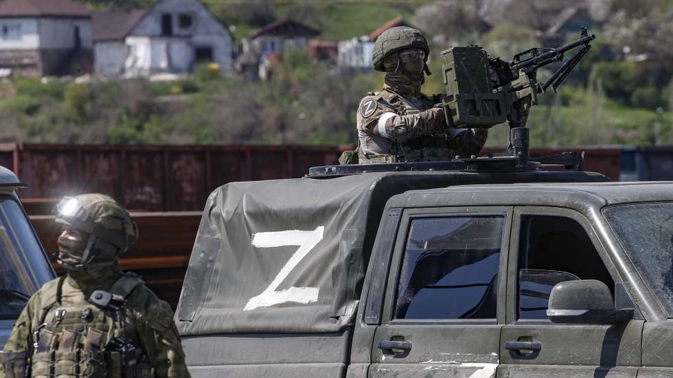 epa09917613 A picture taken during a visit to Mariupol organized by the Russian military shows Russian servicemen guard on the territory of the cargo sea port in Mariupol, Ukraine, 29 April 2022. Mariupol is located on the northern coast of the Sea of Azov, it is one of the largest commercial seaports in Ukraine. Almost 500 thousand people previously lived in the city. On 16 April, the Russian Defense Ministry announced that the urban area of Mariupol had been cleared of the Ukrainian military, and their remnants were completely blocked on the territory of the Azovstal metallurgical plant. On 24 February Russian troops had entered Ukrainian territory in what the Russian president declared a 'special military operation', resulting in fighting and destruction in the country, a huge flow of refugees, and multiple sanctions against Russia.  EPA/SERGEI ILNITSKY