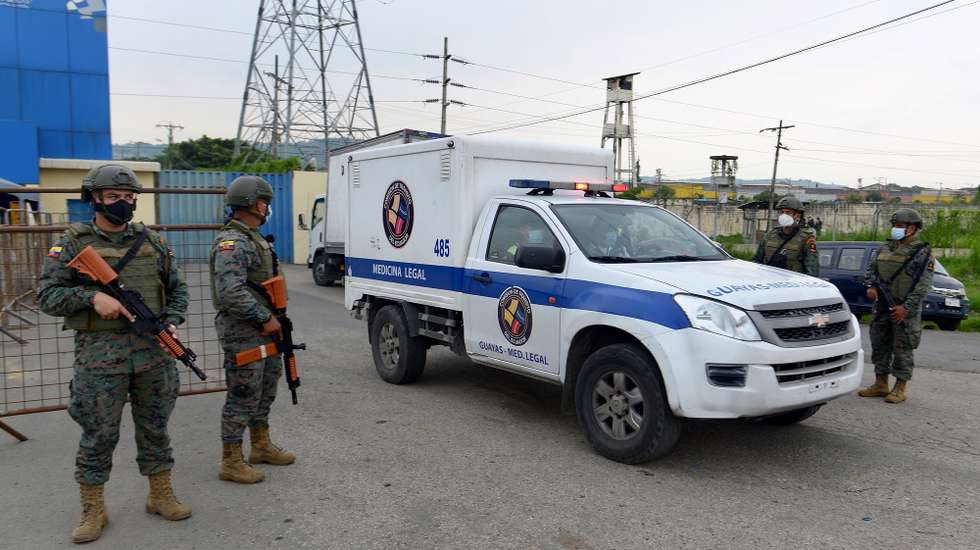 epa09032556 A Forensic Medicine vehicle removes the body of a dead inmate during a riot at the Zonal 8 Deprivation of Liberty Center, in Guayaquil, Ecuador, 23 February 2021. More than 50 inmates died in a series of riots that occurred in three prisons in various cities in Ecuador, the National Police confirmed. 'Given the events that occurred today in the Social Rehabilitation Centers of Guayas, Azuay, and Cotopaxi, the Ecuadorian Police are managing their control. At the moment, Criminalistics reports more than 50 PPL (persons deprived of liberty ) deceased,' they said.  EPA/Marcos Pin