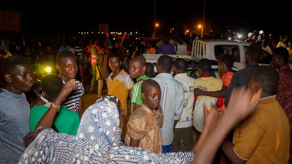 epa10787263 Supporters of the military junta gather at a roundabout leading to Niamey, Niger, 05 August 2023 (issued 06 August 2023). Junta leaders in Niger face a 06 August deadline set by the Economic Community of West African States (ECOWAS) to release and reinstate ousted President Mohamed Bazoum, or face a possible military intervention. On 26 July General Abdourahamane Tchiani declared himself the new leader of Niger after mutinous soldiers led a coup against democratically elected President Bazoum.  EPA/ISSIFOU DJIBO -- BEST QUALITY AVAILABLE