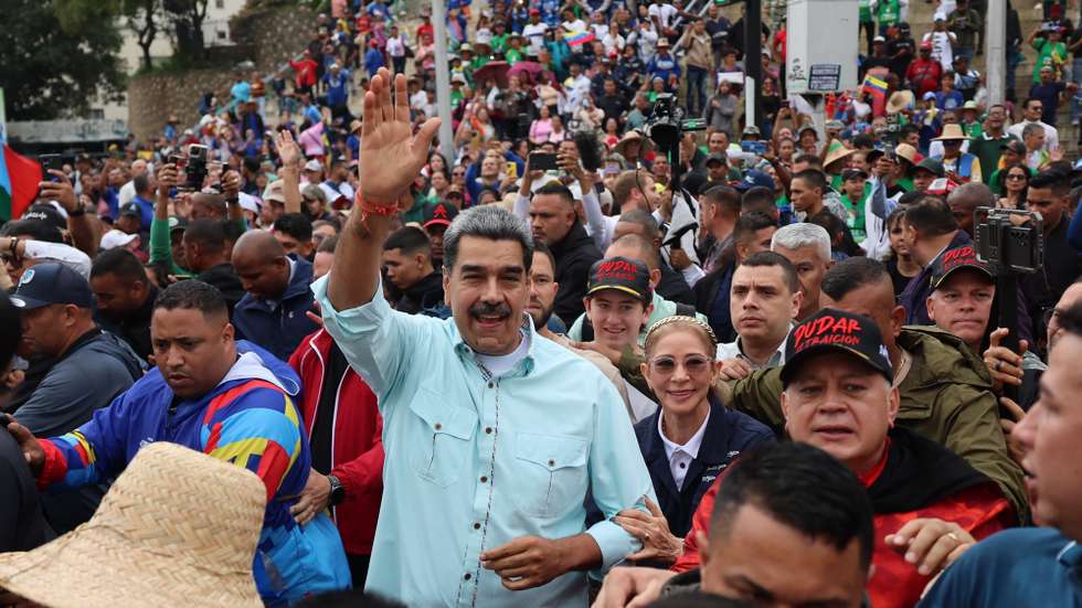epa12583973 Venezuelan President Nicolas Maduro (C) participates in a demonstration organized by the United Socialist Party of Venezuela (PSUV) in Caracas, Venezuela, 10 December 2025. While government supporters rallied in the streets, opposition leader Maria Corina Machado, prevented from running for office by President Nicolas Maduro's administration, was awarded the 2025 Nobel Peace Prize in today’s ceremony in Oslo.  EPA/MIGUEL GUTIERREZ