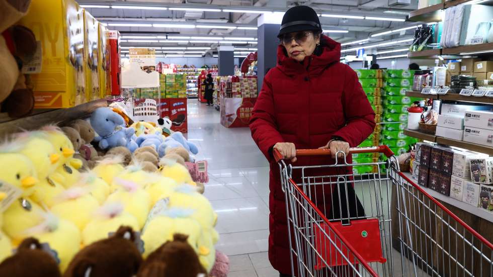 epa12660275 An elderly woman shops in a supermarket in Beijing, China, 19 January 2026. According to the data released by the National Bureau of Statistics (NBS) on 19 January, China's retail sales rose 0.9 percent year-on-year in December 2025, slowing from a 1.3 percent in the previous month and missing market expectations of a 1.2 percent gain.  EPA/WU HAO