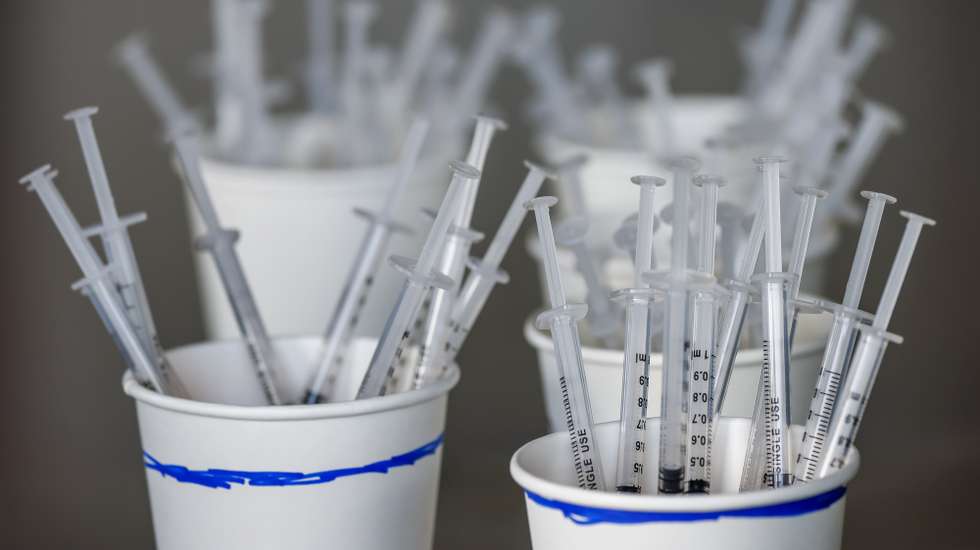 epa09105334 Vaccine syringes await distribution at the Mercedes-Benz Stadium Community Vaccination Center, a jointly run COVID-19 mass vaccination site, in Atlanta, Georgia USA, 29 March 2021. The site, which has averaged more than 8,500 shots per day since its opening to the general public, is jointly operated by the Federal Emergency Management Agency, the Georgia Emergency Management Agency and Fulton County Government.  EPA/ERIK S. LESSER