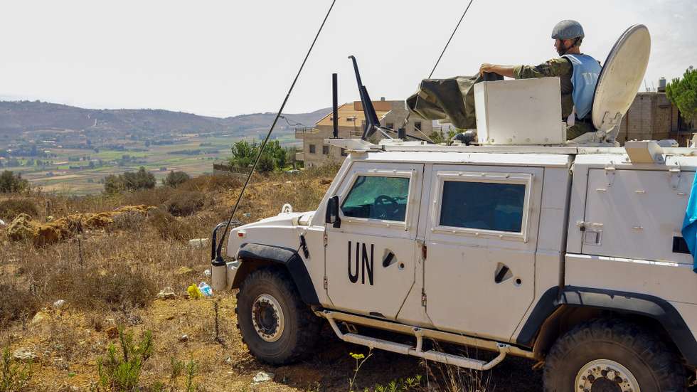 epa11566889 A soldier of the UN peacekeeping mission, United Nations Interim Force in Lebanon (UNIFIL), keeps watch from Marjayoun area opposite Lebanese Khiyam town and Israeli Metula settlement, near the Lebanon-Israel border in southern Lebanon, 27 August 2024. Hezbollah announced in a statement on 25 August that the group launched an aerial operation with numerous drones targeting Israeli territory as the 'phase one' of a retaliatory attack for the killing of senior Hezbollah commander Fuad Shukr on 30 July in Beirut. The Israeli Defense Forces (IDF) said some 100 fighter jets struck and destroyed thousands of Hezbollah rocket launcher barrels, aimed for immediate fire toward northern and central Israel.  EPA/STR