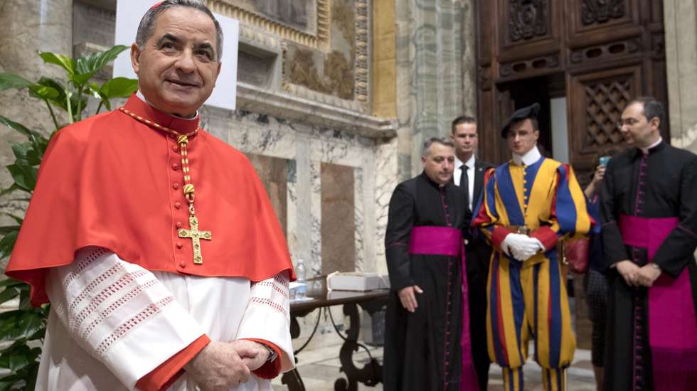 epa06848346 Substitute of the Vatican Secretary of State and Special Delegate for the Sovereign Military Order of Malta from Italy, Giovanni Angelo Becciu (L) poses for photographers after the Pope Francis' Ordinary Public Consistory mass to create 14 new cardinals from 11 countries in Saint Peters Basilica at the Vatican, 28 June 2018. The cardinals-designate are from Bolivia, Iraq, Italy, Japan, Pakistan, Poland, Portugal, Peru, Madagascar, Mexico and Spain.  EPA/CLAUDIO PERI