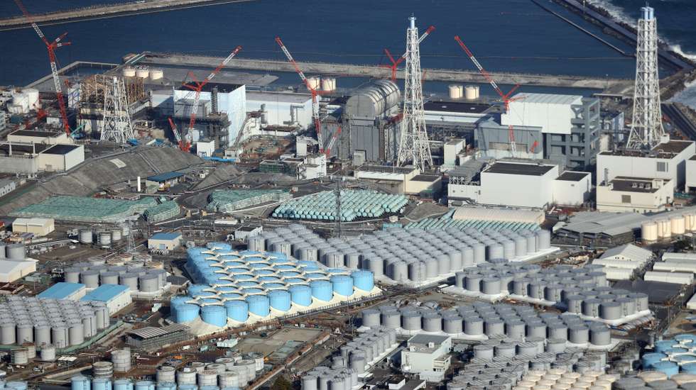 epa09131838 An aerial view shows tanks containing contaminated water at the Fukushima Daiichi nuclear power plant, which suffered meltdowns on 11 March 2011, in Fukushima prefecture, northeastern Japan, 14 February 2021 (reissued 13 April 2021). On 13 April 2021, the Japanese government officially decided to release treated water containing tritium from the crippled Fukushima Daiichi Nuclear Power Plant into the ocean.  EPA/JIJI PRESS JAPAN OUT EDITORIAL USE ONLY/  NO ARCHIVES