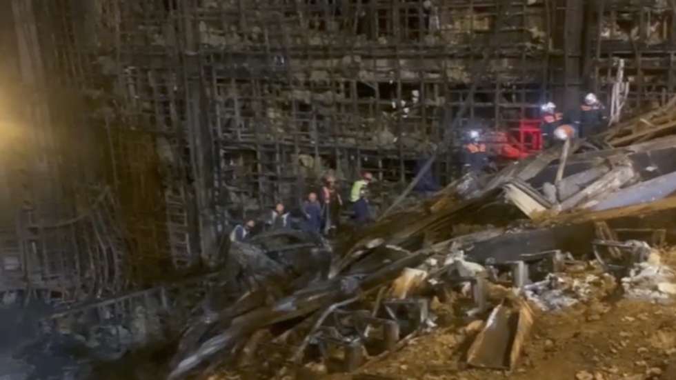 epa11244842 A handout still image taken from a handout video provided by the Russian Emergency Ministry shows rescues clearing debris in the hall of the burnt Crocus City Hall concert venue following a terrorist attack in Krasnogorsk, outside Moscow, Russia, 26 March 2024. At least 137 people were killed and more than 100 hospitalized after a group of gunmen attacked the concert hall in the Moscow region on 22 March evening, Russian officials said. Eleven suspects, including all four gunmen directly involved in the terrorist attack, have been detained, according to Russian authorities.  EPA/RUSSIAN EMERGENCIES MINISTRY HANDOUT   HANDOUT EDITORIAL USE ONLY/NO SALES HANDOUT EDITORIAL USE ONLY/NO SALES