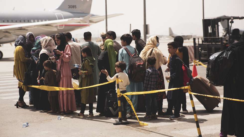 epa09421074 A handout photo made available by US Central Command Public Affairs shows civilians preparing to board a plane during an evacuation at Hamid Karzai International Airport, Kabul, Afghanistan, 18 August 2021 (issued 19 August 2021). US Marines are assisting the Department of State with an orderly drawdown of designated personnel in Afghanistan. (U.S. Marine Corps photo by Staff Sgt. Victor Mancilla) EPA/Staff Sgt. Victor Mancilla/ US Central Command Public Affairs HO Released By:LT Robert MookPublic Affairs OfficerJoint Task Force-Crisis Responserobert.e.mook2.mil@mail.mil HANDOUT EDITORIAL USE ONLY/NO SALES