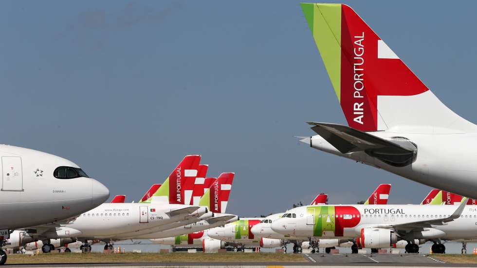 epa08524023 A TAP Air Portugal aircraft grounded at Humberto Delgado airport closed for passenger traffic as part of the exceptional traffic measures to combat the epidemiological situation of Covid-19, in Lisbon, Portugal, 09 April 2020 (reissued 02 July 2020). The granting of state support to TAP has been under discussion since the airline's activity came to a standstill because of the coronavirus pandemic, with an agreed injection of up to 1,200 million euros.  EPA/MANUEL DE ALMEIDA