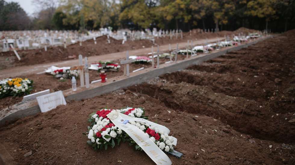 epa08859947 Special burial sites for the dead from coronavirus (COVID-19) are dug out on the Municipal Cemetery of the Resurrection of the Lord, in Thessaloniki, Greece, 03 December 2020. New graves are being opened by municipal crews while Thessaloniki is still at the center of the second wave of the pandemic, with the National Public Health Organization in Greece (EODY) recording 453 cases out of a total of 2,186 on 02 December.  EPA/ACHILLEAS CHIRAS