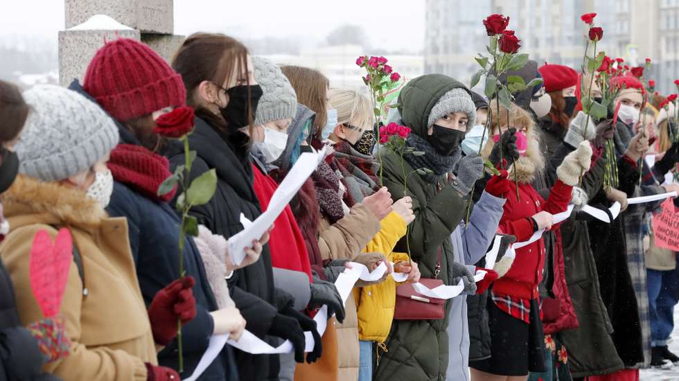 epa09012035 Russian feminists take part in a protest action in support of Russian opposition leader Alexei Navalny and all political prisoners on the occasion of Valentine's Day in St. Petersburg, Russia, 14 February 2021. Navalny was detained after his arrival to Moscow from Germany on 17 January 2021. The Simonovsky city court decided to grant the Federal Penitentiary Service petition to replace Navalny's three and a half year suspended sentence with a prison sentence. He was jailed on 02 February 2021.  EPA/ANATOLY MALTSEV