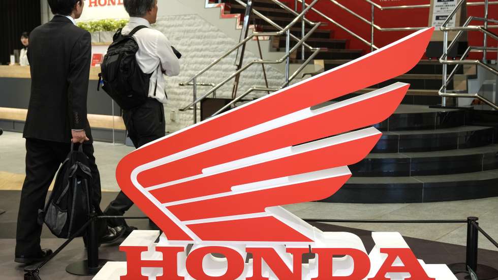 epa11330819 Visitors walk past the Honda Motorcycle logo at Honda Motor headquarters in Tokyo, Japan, 10 May 2024. Honda Motor announced its financial results for the fiscal year until 31 March 2024, with sales revenue increased by 20.8 percent to 20,428.8 billion Japanese Yen (around 121 billion Euro) from the 2023 fiscal year, due to among others an increased sales revenue in the automobile business. The company also reported an increased operating profit by 77.0 per cent to 1,381.9 billion yen (around 8 billion Euro) from the previous fiscal year.  EPA/KIMIMASA MAYAMA