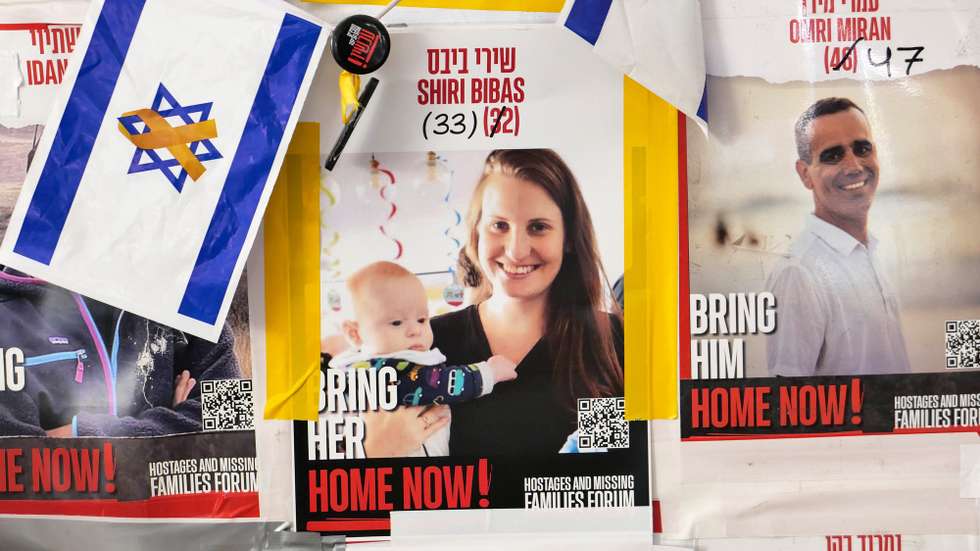 epaselect epa11906493 A poster of Israeli hostage Shiri Bibas at a protest camp of hostages' families near Prime Minister Netanyahu's residence in Jerusalem, 19 February 2025. Hamas announced that the bodies of Shiri Bibas and her toddler sons, Ariel and Kfir, along with another dead hostage, would return to Israel in coffins on 20 February. According to Israel's military, around 100 Israeli hostages remain in captivity in the Gaza Strip, including the bodies of at least 33 confirmed dead.  EPA/ABIR SULTAN