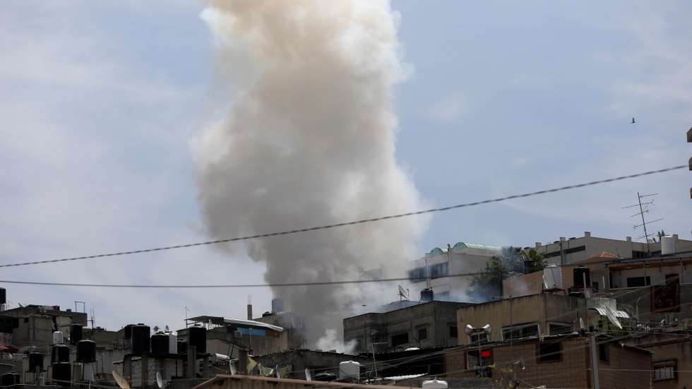 epa11290397 Smoke rises as a result of an explosion during an Israeli army operation in the West Bank refugee camp of Nour Shams, 20 April 2024. According to an Israeli army spokesperson, the Israeli military has been carrying out a raid on Nur Shams for more than 40 hours. Since the beginning of the activity, eight soldiers were injured with minor and moderate injuries, and several Palestinians were killed and injured.  EPA/STRINGER