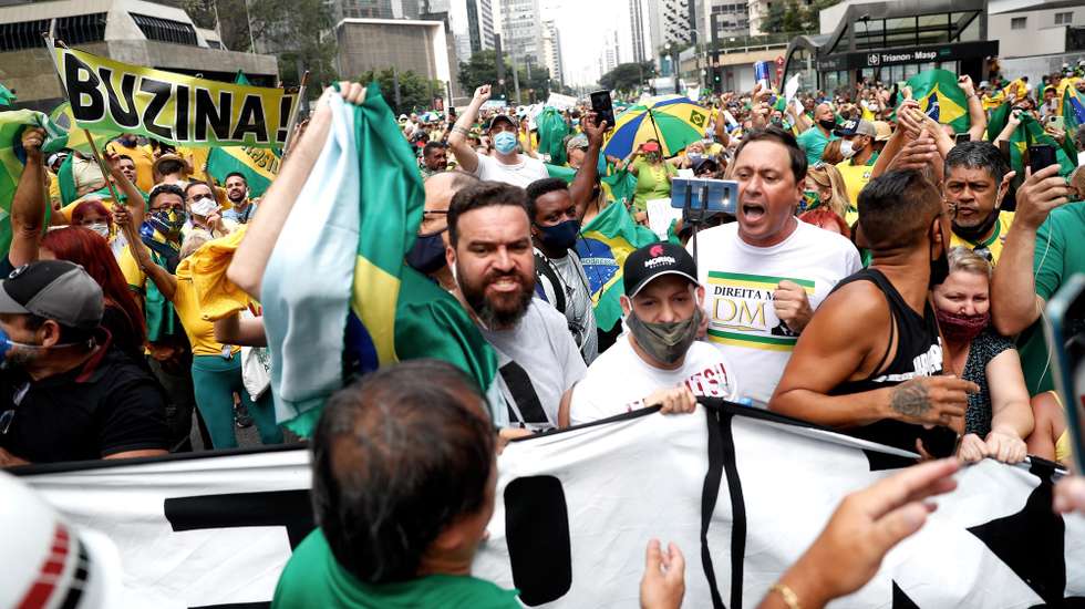 epa09074742 Demonstrators protest against the closure of businesses due to the pandemic in Sao Paulo, Brazil, 14 March 2021. Followers of the Brazilian President Jair Bolsonaro protested in the main cities of the country, such as Sao Paulo, Rio de Janeiro, Brasilia and Belo Horizonte, against the restrictive measures imposed by regional governments to stop the COVID-19 pandemic.  EPA/Fernando Bizerra Jr