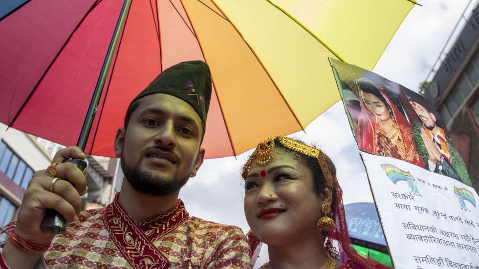 epa10830588 Nepal’s same-sex couple Maya Gurung (R) and Surendra Panday wearing traditional attire take part in the Lesbian, Gay, Bisexual and Transgender (LGBT) pride parade in Kathmandu, Nepal, 31 August 2023. Thousands of LGBT activists and members of Blue Diamond society, LGBT rights organization, participated in the parade demanding equal rights.  EPA/NARENDRA SHRESTHA