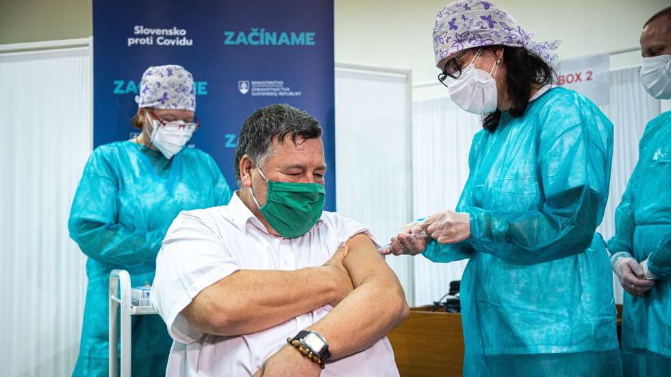 epa08905034 Slovak infectologist Vladimir Krcmery receives a first Slovak vaccine of the Pfizer-BioNTech against the COVID-19 at the faculty hospital in Nitra, Slovakia, 26 December 2020. Slovakia started with vaccination in the evening on 26 December 2020. Some 12.5 million doses of the vaccine are being shipped to European countries after the European Medicines Agency (EMA) gave the green light to European countries to start COVID-19 vaccinations in the coming days using shot jointly developed by US company Pfizer and its German partner BioNTech.  EPA/STRINGER