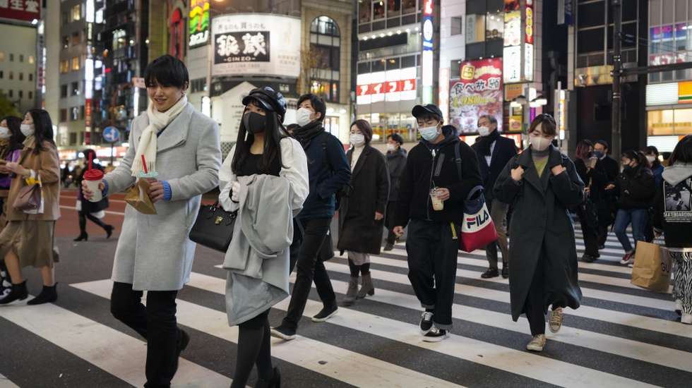 epa08872544 Pedestrians walk at Shinjuku, Japan's biggest entertainment area, decorated with seasonal illumination in Tokyo, Japan, 09 December 2020, after Japan marked highest new infections to the COVID-19 Coronavirus per day. Japan marked highest record of 2,806 people newly infected to the COVID-19 Coronavirus per day and Tokyo recorded second highest cases of 572 per day on 09 December 2020. Japan's Self-Defense Forces medial team was dispatched by the request of Hokkaido, northern Japan to support hospitals in Asahikawa City, second biggest city in Hokkaido, where medical system is very tight.  EPA/KIMIMASA MAYAMA