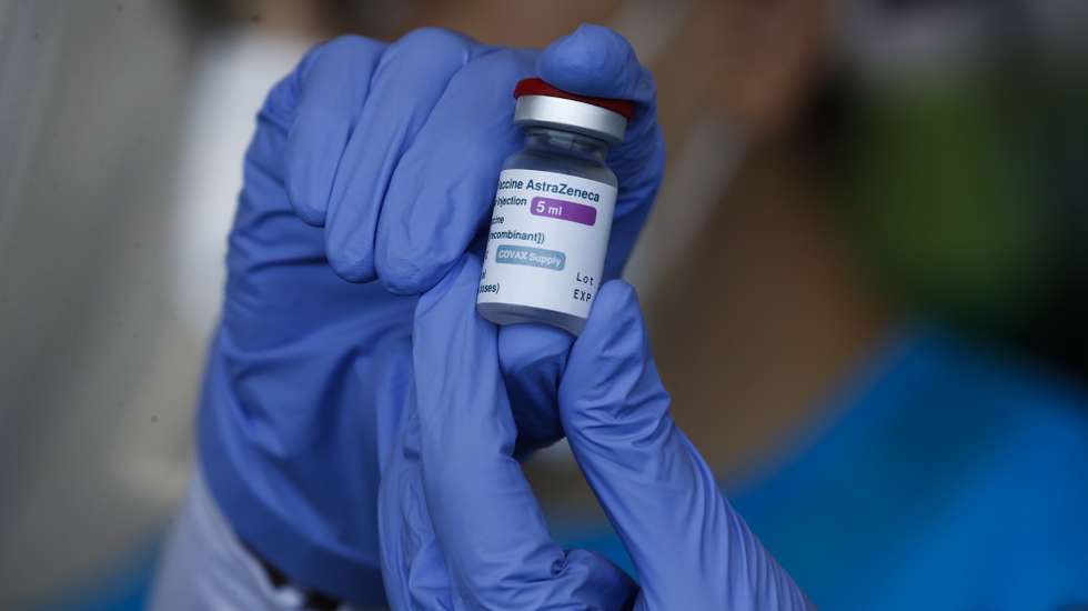 epa09055631 A health worker holds a vial of the AstraZeneca COVID-19 vaccine during a vaccination drive at a hospital in Paranaque City, Metro Manila, Philippines 06 March 2021.The arrival of the AstraZeneca vaccines from Europe follows the shipment of Sinovac vaccines from China, as the Philippines continues its COVID-19 vaccination campaign.  EPA/ROLEX DELA PENA