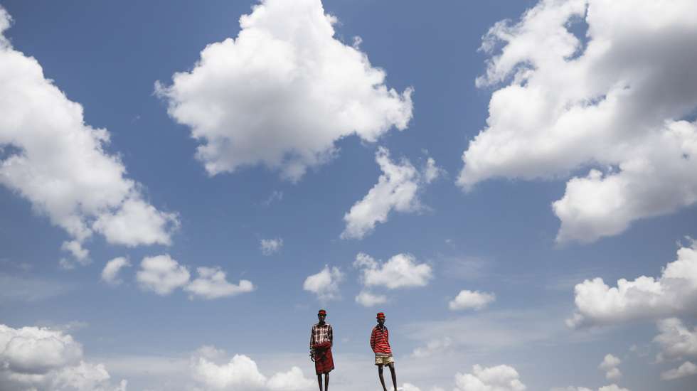 epaselect epa07734795 (15/30) Local Turkana men stand next to a dam constructed to help refugees and locals in agriculture and livestocks in Kalobeyei settlement, adjacent to Kakuma Refugee Camp in Turkana county, northern Kenya, 25 June 2019. Despite an improvement, the United Nations World Food Programme (WFP) in its 2018 report classifies the nutrition situations in Kakuma camp and adjacent Kalobeyei settlement as 'serious' and 'poor' respectively. More than 10 percent of refugees in Kakuma camp suffered from acute malnutrition in 2017.  EPA/DAI KUROKAWA  ATTENTION: For the full PHOTO ESSAY text please see Advisory Notice epa07734780